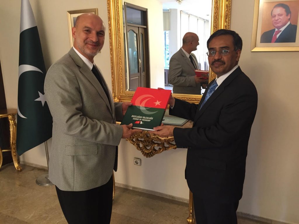  Ambassador Sohail Mahmood presenting a book to President of DEIK